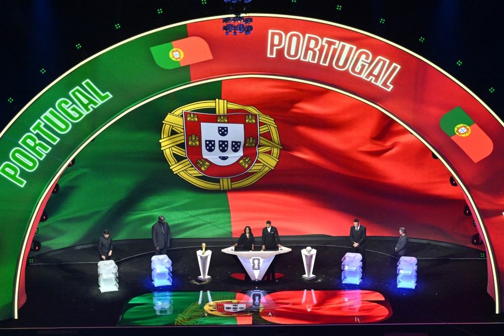Portugal's flag is displayed on a screen during the draw for the 2026 FIFA Football World Cup taking place in the US, Canada and Mexico, at the Kennedy Center, in Washington, DC, on December 5, 2025. (Photo by Roberto SCHMIDT / AFP)