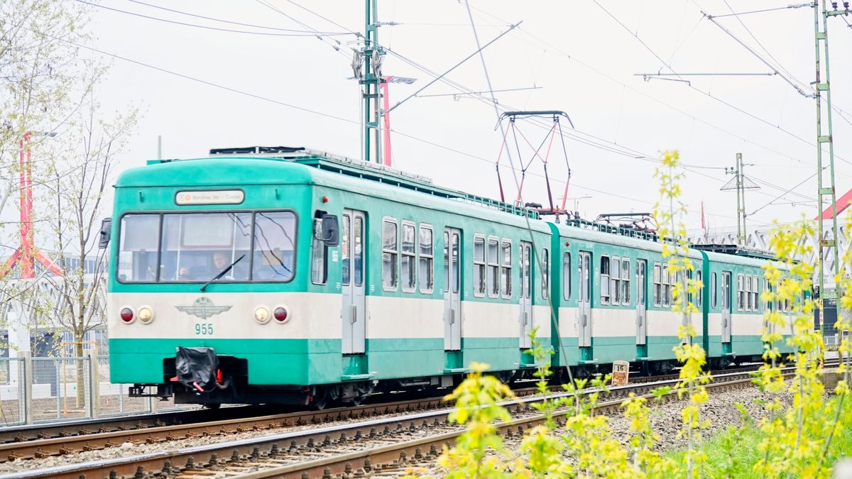 Budapest, Hungary - Apr 9, 2023: HEV Suburban train moving from Boraros Square to Csepel. Suburban trains are a very important part of the city traffic in Budapest. They are called HEV (hév).