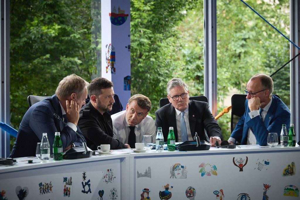 This handout photograph taken and released by the Ukrainian Presidential Press Service on May 16, 2025, shows Ukraine's President Volodymyr Zelensky (2nd L), Poland's Prime Minister Donald Tusk (L), France's President Emmanuel Macron (C), Britain's Prime Minister Keir Starmer (2nd R) and Germany's Chancellor Friedrich Merz (R) taking part in a meeting during the European Political Community (EPC) summit, in Tirana on May 16, 2025. (Photo by Handout / UKRAINIAN PRESIDENTIAL PRESS SERVICE / AFP) / RESTRICTED TO EDITORIAL USE - MANDATORY CREDIT "AFP PHOTO / Ukrainian Presidential Press Service" - NO MARKETING NO ADVERTISING CAMPAIGNS - DISTRIBUTED AS A SERVICE TO CLIENTS