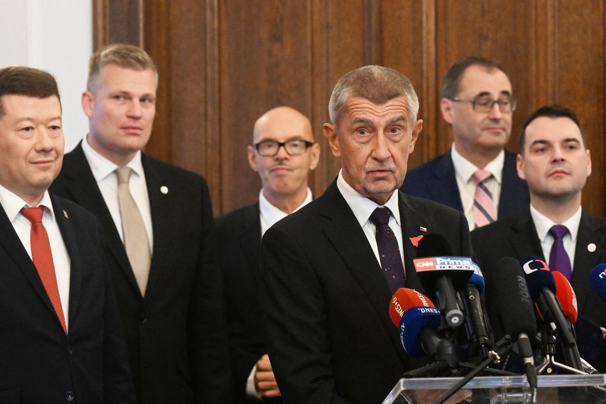 The leader of Czech Republic's ANO Party and candidate for Prime Minister Andrej Babis (3rd R) answers to journalists after signing a new coalition government agreement with the leader of SPD party Tomio Okamura (L) and the leader of Motorists for Themselves party Petr Macinka (R) at the Czech Parliament in Prague on November 3, 2025. The party of self-described "Trumpist" Babis topped the October 3-4 poll with 34.5 percent of the vote, but failed to get an outright majority with 80 seats in the 200-member parliament. (Photo by Michal Cizek / AFP)