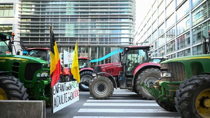Tractors park in line near the European Parliament district, during a farmers' protest to denounce the reforms of the Common Agricultural Policy (CAP) and trade agreements such as the Mercosur, in Brussels, on December 18, 2025, organised by Copa-Cogeca, the main association representing farmers and agricultural cooperatives in the EU. EU Farmers, particularly in France, worry the Mercosur deal -- which will be discussed at the EU leaders meeting -- will see them undercut by a flow of cheaper goods from agricultural giant Brazil and its neighbours. They also oppose plans put forward by the European Commission to overhaul the 27-nation bloc's huge farming subsidies, fearing less money will flow their way. (Photo by NICOLAS TUCAT / AFP)