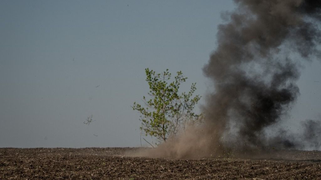 A photo shows a remotely detonated mine in a minefield near the village of Korobochkine, Kharkiv region, on April 29, 2025, amid the Russian invasion of Ukraine. (Photo by Ivan SAMOILOV / AFP)