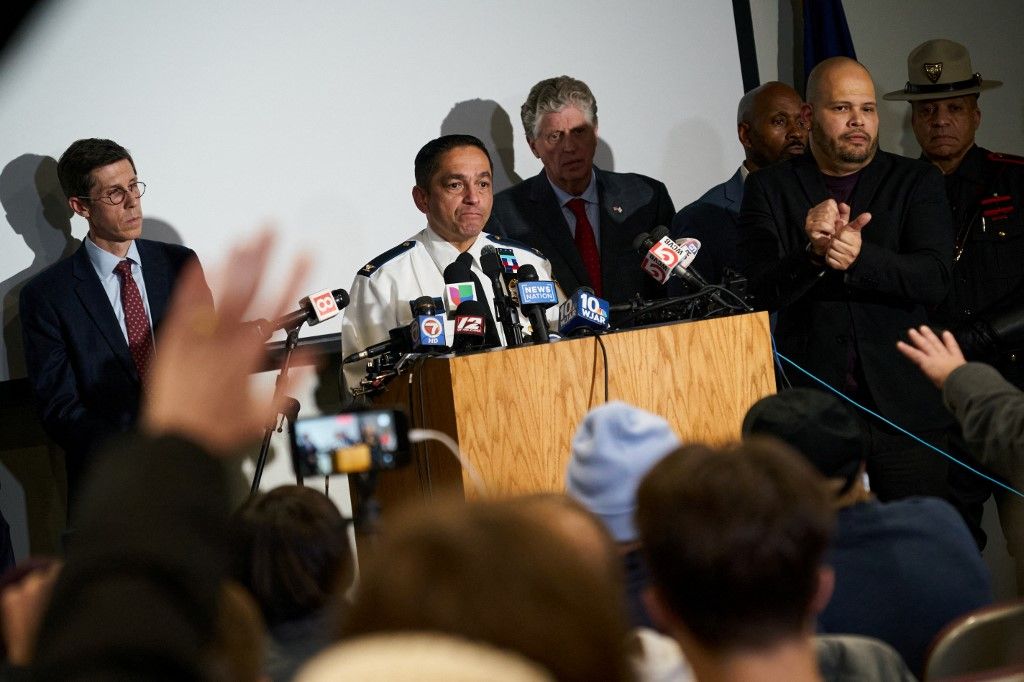 Colonel Oscar Perez, chief of the Providence Police Department, speaks during a press conference into the ongoing investigation into the December 13 mass shooting at Brown University, at the Providence Public Safety Complex in Providence, Rhode Island, on December 15, 2025. A gunman remained at large after a weekend mass shooting at elite Brown University left two dead and nine wounded, with US authorities releasing new footage of a masked "person of interest" captured on surveillance cameras. The shooting took place Saturday in a building where exams were underway on the Ivy League campus in Providence, Rhode Island when a man with a rifle burst in and opened fire before fleeing. (Photo by Bing Guan / AFP)
