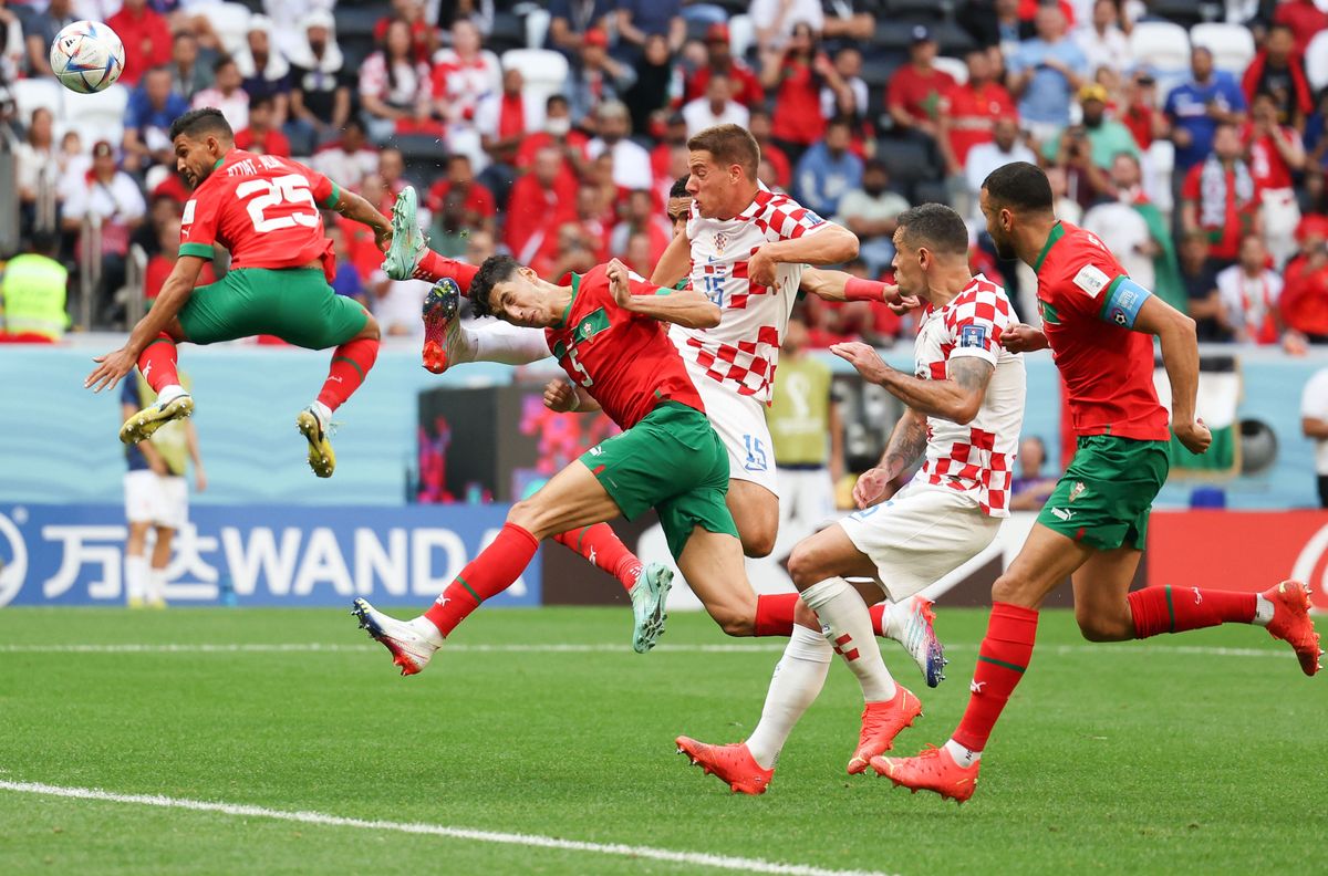 (230110) -- BEIJING, Jan. 10, 2023 (Xinhua) -- Yahya Attiat-Allah (1st L) of Morocco vies for a header during the Group F match between Morocco and Croatia at the 2022 FIFA World Cup at Al Bayt Stadium in Al Khor, Qatar, Nov. 23, 2022. (Xinhua/Jia Haocheng) (Photo by Jia Haocheng / Xinhua via AFP)