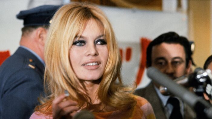 (FILES) French actress Brigitte Bardot (C) gives a press conference on December 1965 in Hollywood for the film "Viva Maria", directed by Louis Malle (background). The American film "Dear Brigitte" (Chère Brigitte), directed by Henry Koster, was released at the same year. Brigitte Bardot, legendary French actress, female icon of the 1960s and fervent animal rights activist, has died at the age of 91, the Brigitte Bardot Foundation announced on December 28, 2025. (Photo by AFP)