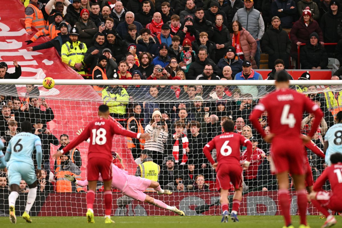 A penalty kick from Liverpool's Hungarian midfielder #08 Dominik Szoboszlai hits the crossbar during the English Premier League football match between Liverpool and Burnley at Anfield in Liverpool, north west England on January 17, 2026. (Photo by Oli SCARFF / AFP) / RESTRICTED TO EDITORIAL USE. No use with unauthorized audio, video, data, fixture lists, club/league logos or 'live' services. Online in-match use limited to 120 images. An additional 40 images may be used in extra time. No video emulation. Social media in-match use limited to 120 images. An additional 40 images may be used in extra time. No use in betting publications, games or single club/league/player publications. / 
