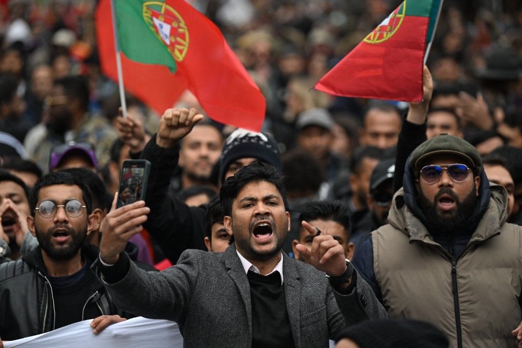 LISBON, PORTUGAL - JANUARY 11: Migrants demonstrate in the streets of Lisbon, calling for better working and living conditions, and protesting against discrimination on January 11, 2025 in Lisbon, Portugal. The demonstration included banners and chants demanding equal rights and justice for migrant workers. Zed jameson / Anadolu (Photo by Zed jameson / Anadolu via AFP)