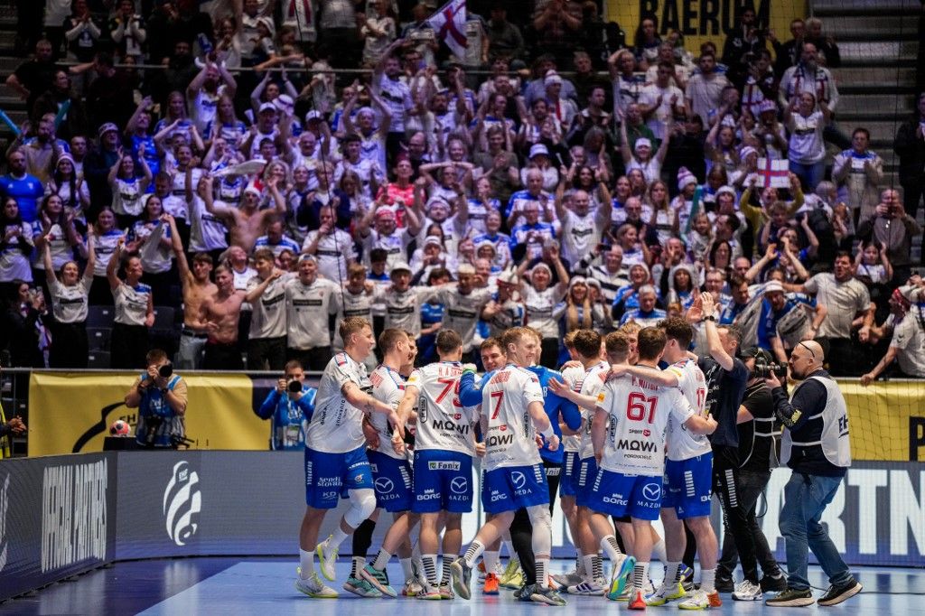 Faroes' players and fans celebrate after the men's EHF Euro 2026 preliminary round handball match Faroe Islands vs Switzerland at the Unity Arena in Fornebu near Oslo on January 16, 2026. (Photo by Cornelius Poppe / NTB / AFP) / Norway OUT