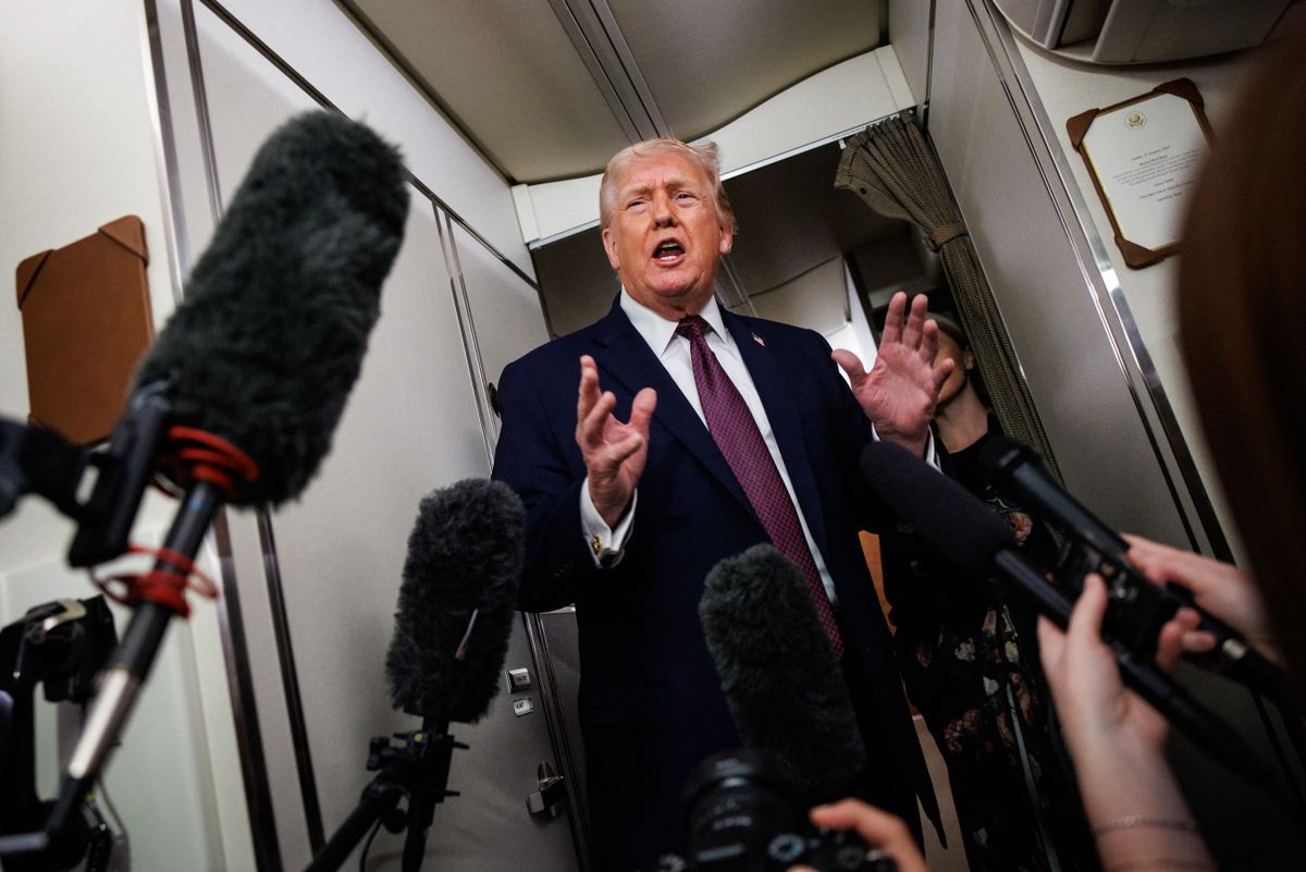 IN FLIGHT - JANUARY 11: U.S. President Donald Trump takes questions from the members of the press aboard Air Force One on January 11, 2026 en route back to the White House from Palm Beach, Florida. The President spent the weekend at his private club Mar-a-Lago in Palm Beach, Florida.   Samuel Corum/Getty Images/AFP (Photo by Samuel Corum / GETTY IMAGES NORTH AMERICA / Getty Images via AFP)