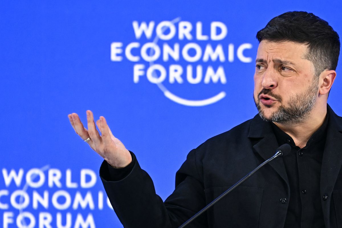 Ukraine's President Volodymyr Zelensky gestures as he speaks during the World Economic Forum (WEF) annual meeting in Davos on January 22, 2026. The World Economic Forum takes place in Davos from January 19 to January 23, 2026. (Photo by Fabrice COFFRINI / AFP)
