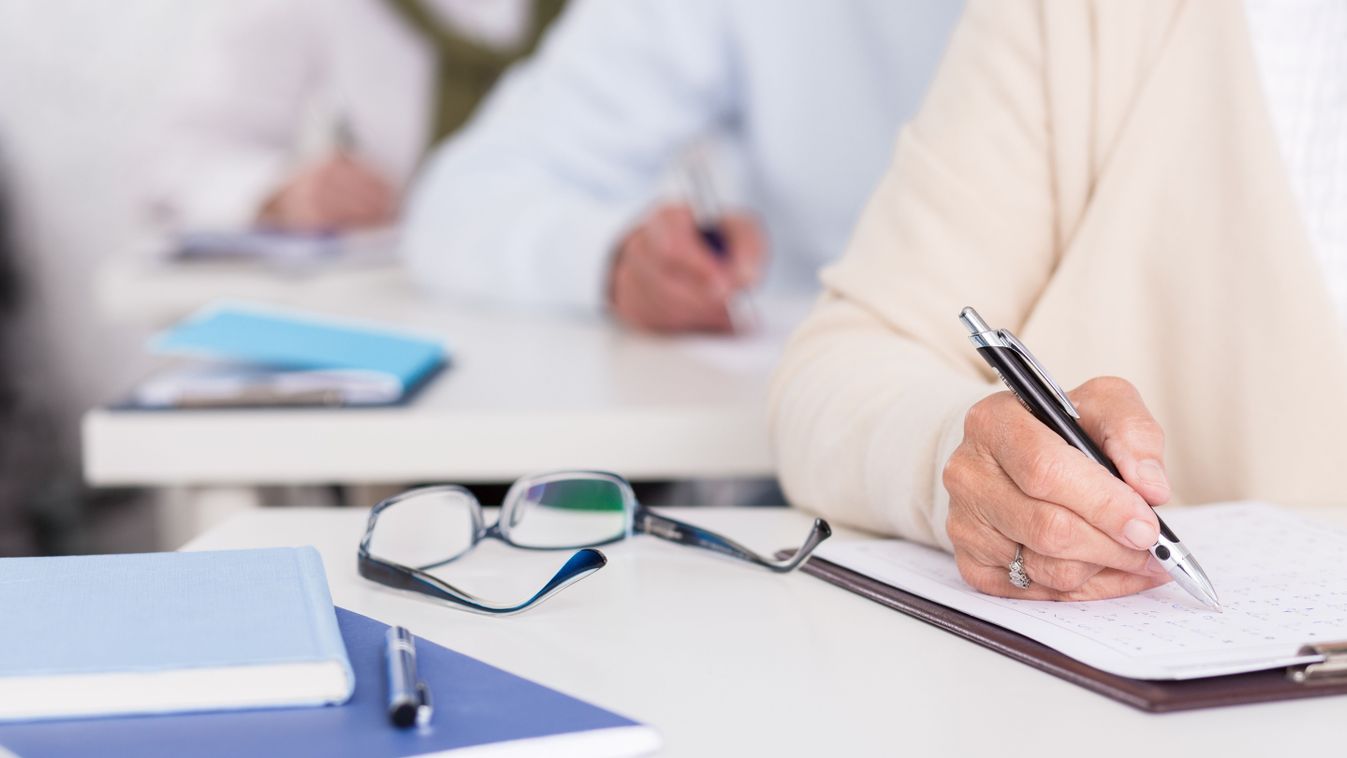 Close up of senior students during written exam

324361415