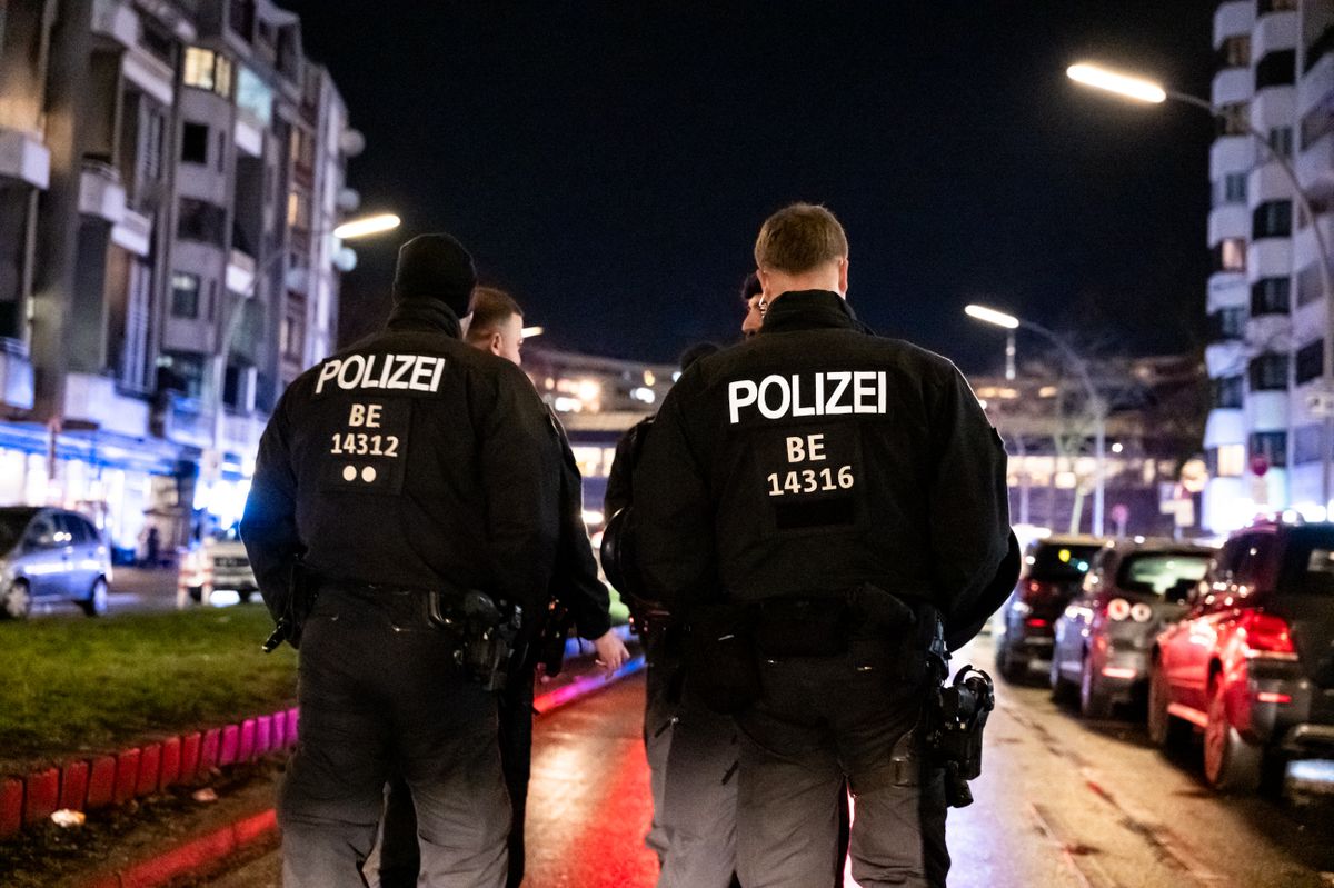 Policemen and police vehicles are at Kottbusser Tor during a demonstration in support of Iranian protesters in Berlin, Germany, on January 14, 2026. (Photo by Emmanuele Contini/NurPhoto) (Photo by Emmanuele Contini / NurPhoto via AFP)