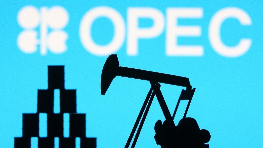 OPEC (Organization of the Petroleum Exporting Countries) organization logo and miniature models of an oil derrick pump and oil barrels are pictured in this illustration photo taken in Kyiv on 14 August, 2021. (Photo by STR/NurPhoto) (Photo by NurPhoto via AFP)