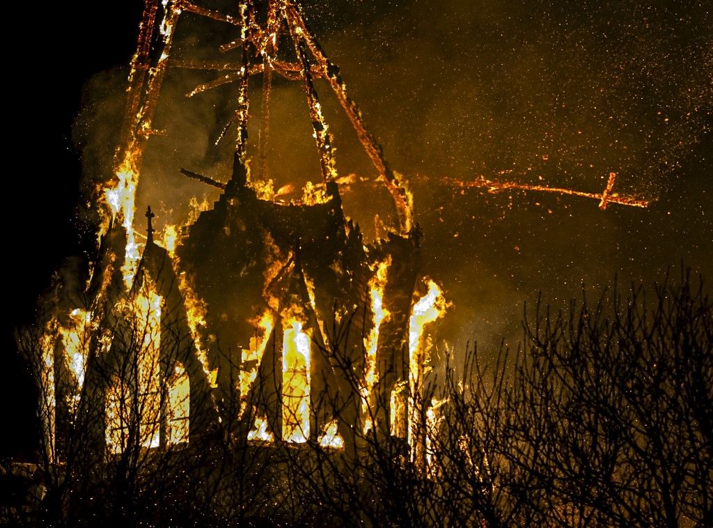 AMSTERDAM  A fire broke out in the tower of the Vondelkerk in Amsterdam on New Year's Eve. The church is located near Vondelpark in the capital. REMKO DE WAAL / ANP netherlands out - belgium out (Photo by REMKO DE WAAL / ANP MAG / ANP via AFP)