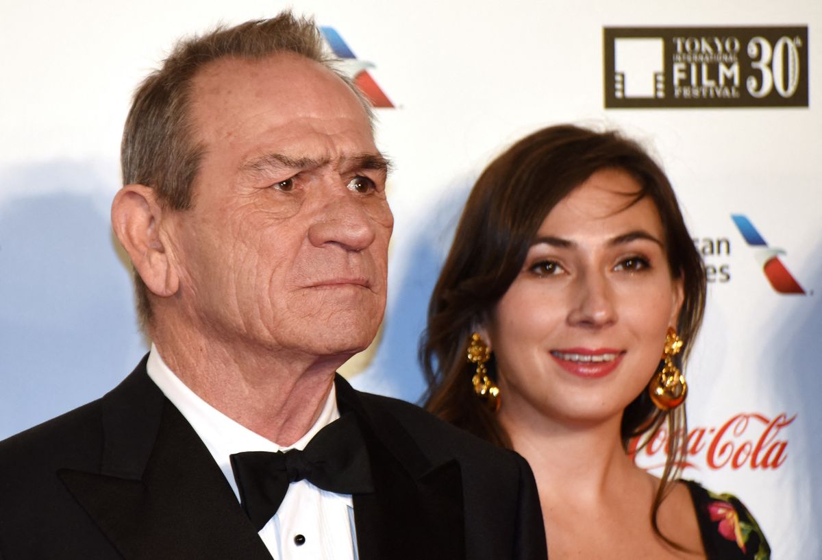 US actor Tommy Lee Jones (L) as president of jury, poses with his daughter Victoria Jones (R) in a photo session prior to the opening ceremony of the 30th Tokyo International Film Festival in Tokyo on October 25, 2017. The film festival will be held from October 25 to November 3, 2017. (Photo by Kazuhiro NOGI / AFP)