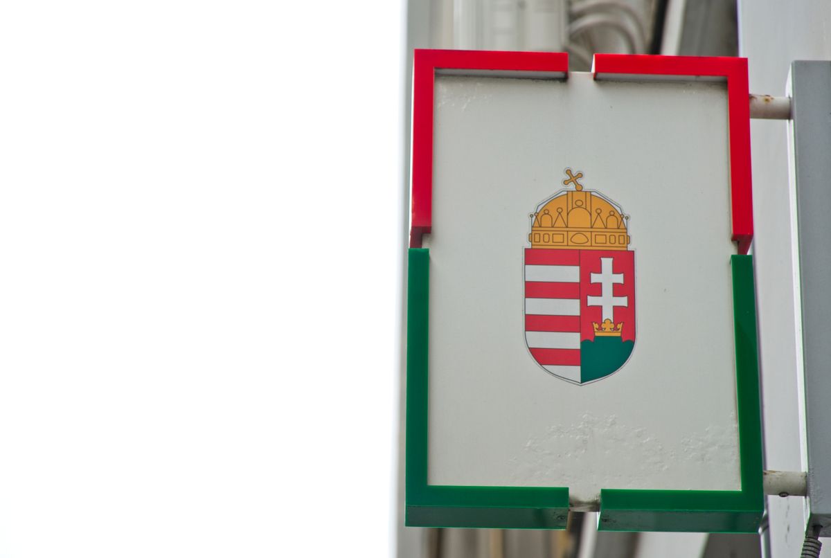 Budapest, Hungary - June 20, 2024: Coat of arms of Hungary in front of the Building. Hungarian Government office of the 1st district of Budapest.