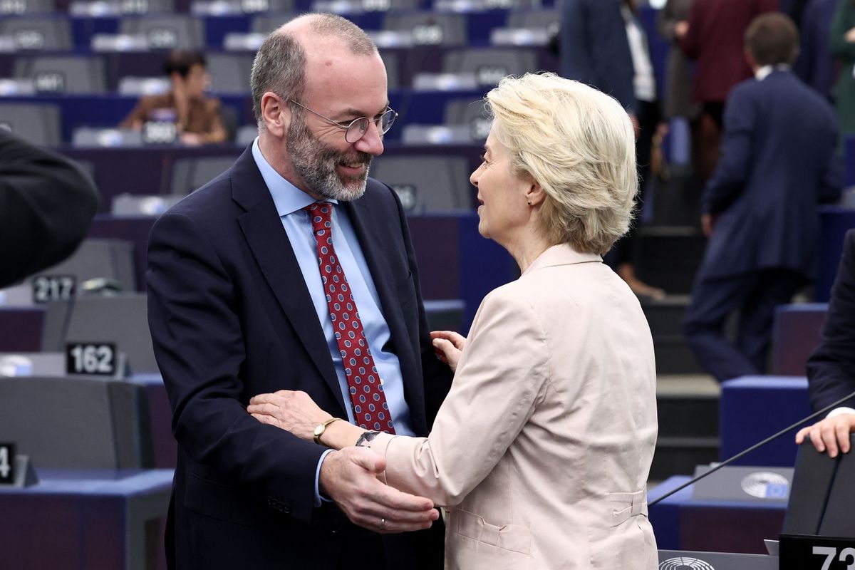 European Commission President Ursula von der Leyen (R) speaks with the President of the centre-right European People's Party (EPP) Manfred Weber ahead of the presentation of the College of Commissioners and their programme at the European Parliament on November 27, 2024 in Strasbourg, eastern France. (Photo by FREDERICK FLORIN / AFP)