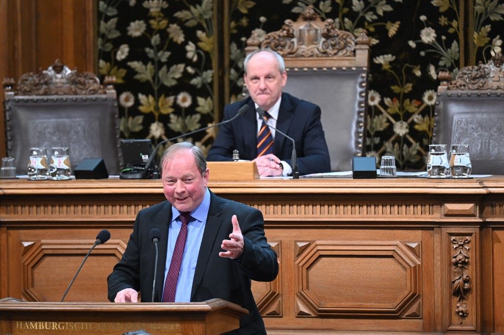 26 March 2025, Hamburg: Dirk Nockemann (front), leader of the AfD parliamentary group, speaks in the plenary chamber of the Hamburg Parliament. Ralf Niedmers (CDU) sits in the background. Three and a half weeks after the Hamburg elections, the new Hamburg Parliament is constituted. The 121 members of parliament meet for the first time in the plenary chamber of the town hall. Photo: David Hammersen/dpa (Photo by David Hammersen / dpa Picture-Alliance via AFP)
