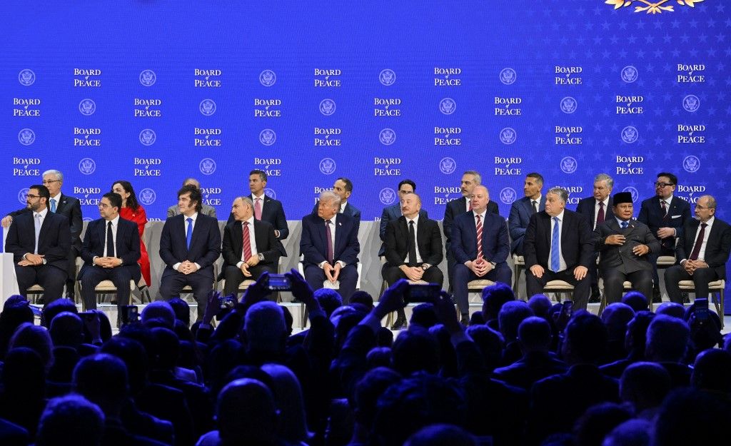 DAVOS, SWITZERLAND - JANUARY 22: US President Donald Trump, Azerbaijani President Ilham Aliyev, Moroccan Foreign Minister Nasser Bourita, Argentine President Javier Milei and Armenian Prime Minister Nikol Pashinyan, Turkish Foreign Minister Hakan Fidan and Hungarian Prime Minister Viktor Orban attend the signing ceremony of the Peace Charter for Gaza as part of the 56th World Economic Forum in Davos, Switzerland on January 22, 2026. Harun Ozalp / Anadolu (Photo by Harun Ozalp / Anadolu via AFP)