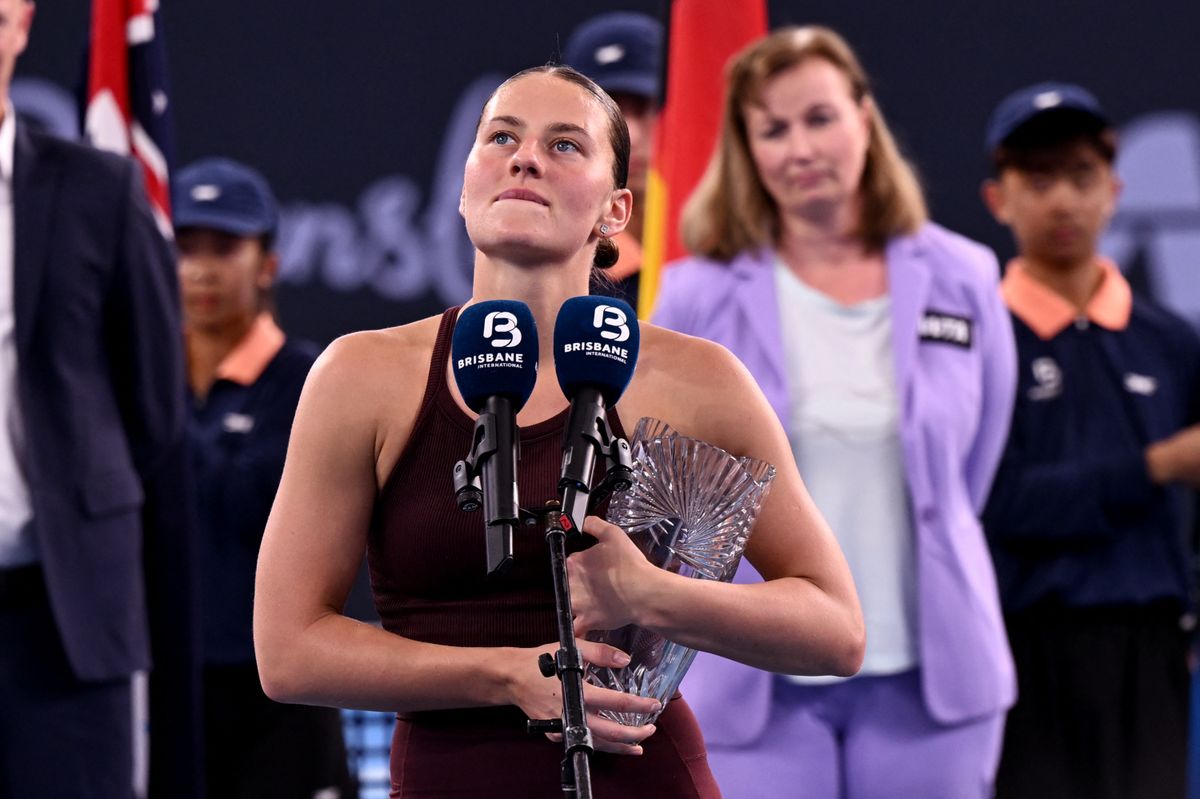 Marta Kostyuk of Ukraine speaks after defeat in the women's singles final against Aryna Sabalenka of Belarus at the Brisbane International tennis tournament in Brisbane on January 11, 2026. (Photo by William WEST / AFP) / --IMAGE RESTRICTED TO EDITORIAL USE - STRICTLY NO COMMERCIAL USE--