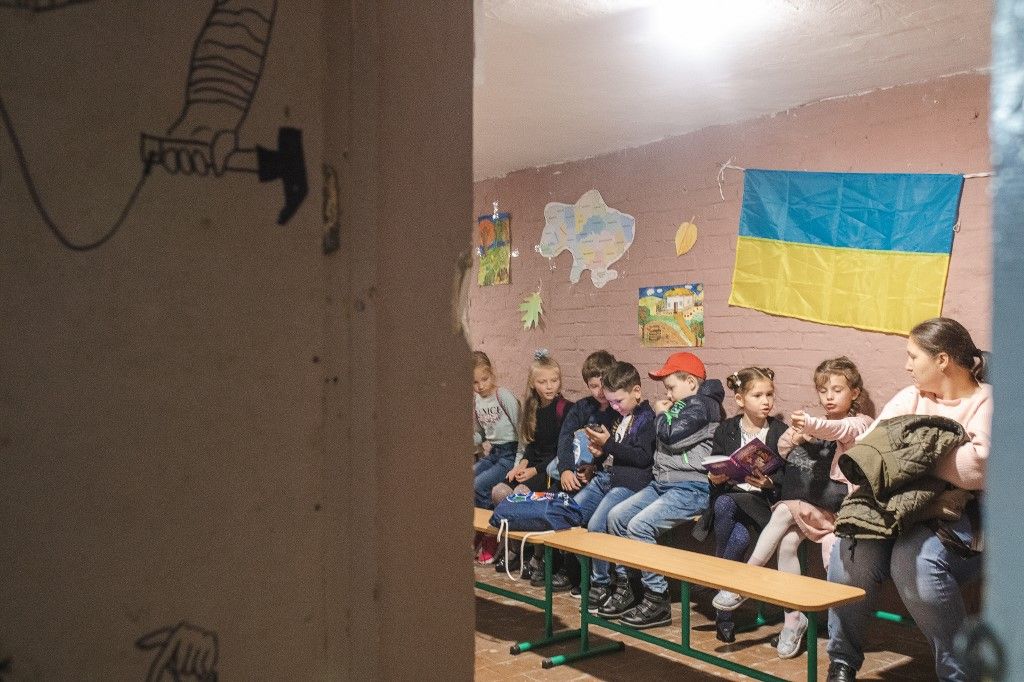 KYIV, UKRAINE - SEPTEMBER 16: Ukrainian students study in a shelter as fierce battles rage in the east and south of Ukraine, many Ukrainian children go to classrooms in a show of resilience despite the ongoing threat of indiscriminate Russian missile strikes that have hit civilian infrastructure in normally quiet cities, in Kyiv, Ukraine on September 16, 2022. Many schools are offering a dual-format where children can also resume education online at the request of their parents. Gian Marco Benedetto / Anadolu Agency (Photo by Gian Marco Benedetto / ANADOLU AGENCY / Anadolu via AFP)