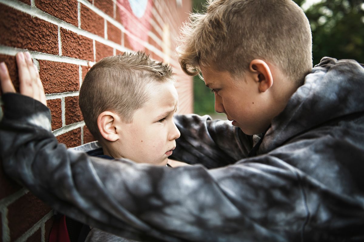 sad intimidation moment Elementary Age Bullying in Schoolyard