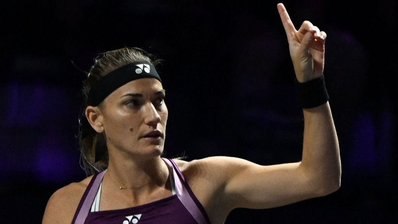 RIYADH, SAUDI ARABIA - NOVEMBER 8: Timea Babos of Hungary plays a backhand with partner Luisa Stefani of Brazil against Veronika Kudermetova of Russia and Elise Mertens of Belgium during their doubles final match on Day 8 of the 2025 WTA Finals, part of t
