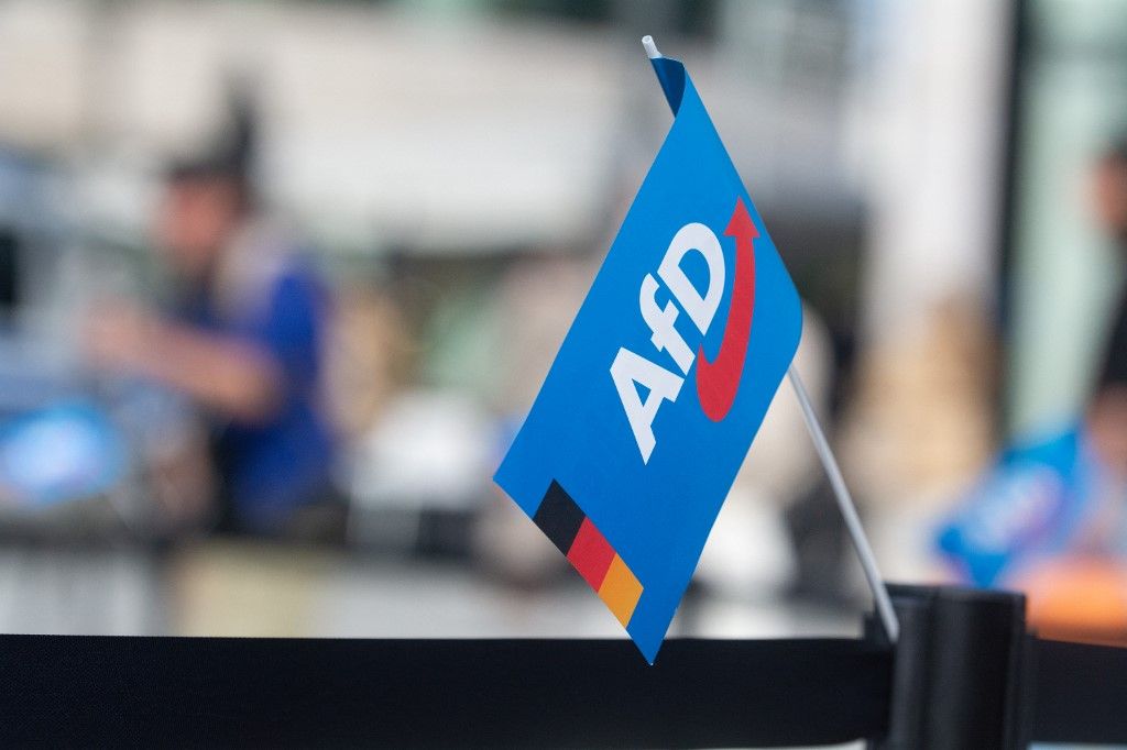 An AFD flag is seen at the rally site as hundreds of counter-protesters gather on the opposite side of the AFD rally two days ahead of the regional election in Duesseldorf, Germany, on September 14, 2025. (Photo by Ying Tang/NurPhoto) (Photo by Ying Tang / NurPhoto via AFP)