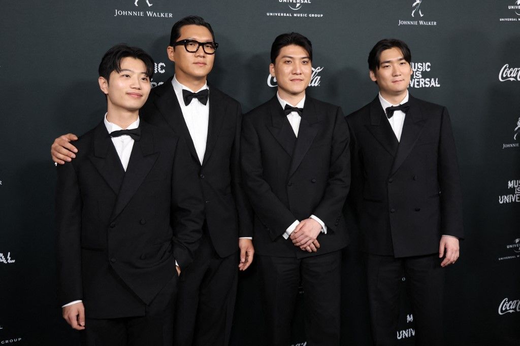 (L-R) "KPop Demon Hunters" soundtrack writers DemonYu Han Lee, Jeong Hoon Seo, Joong Gyu Kwak and Hee Dong Nam attend Universal Music Group's Grammy after party at Nya Studios West in Los Angeles on February 1, 2026. (Photo by Michael Tran / AFP)