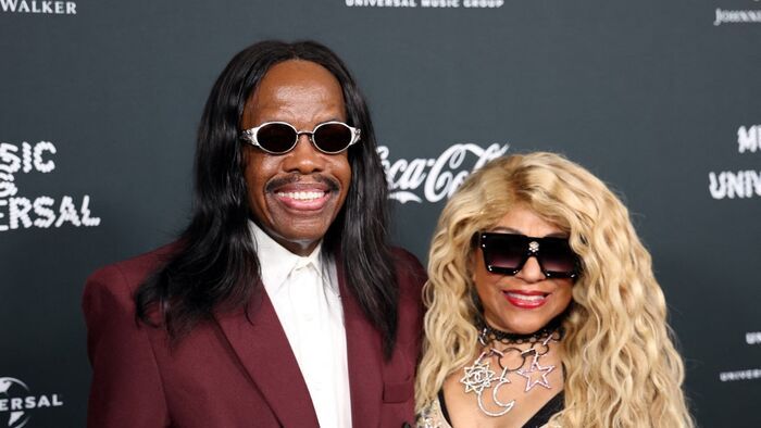US musician Verdine White (L), founding member of the band Earth, Wind & Fire, and US singer and dancer Shelly Clark, attend Universal Music Group's Grammy after party at Nya Studios West in Los Angeles on February 1, 2026. (Photo by Michael Tran / AFP)
