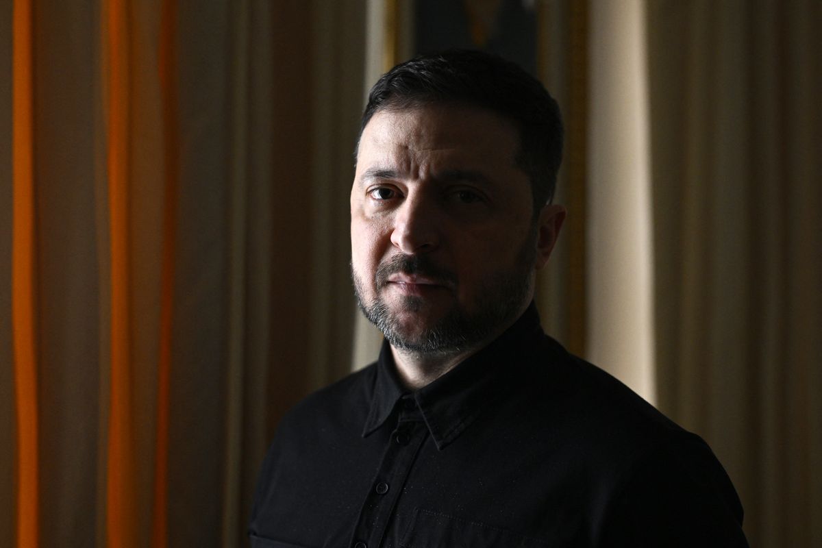 Ukraine's President Volodymyr Zelensky poses during a photo session on the sidelines of an interview with AFP journalists in Kyiv on February 20, 2026, amid the Russian invasion of Ukraine. AFP has conducted an exclusive interview with Zelensky who spoke at length, as Ukraine prepares to enter its fifth year of war. (Photo by Genya SAVILOV / AFP)