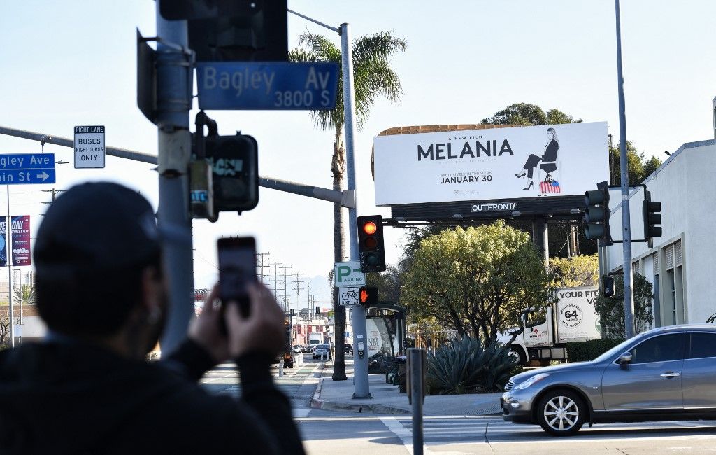 A billboard advertising the film Melania is seen vandalized, allegedly by the activist art collective INDECLINE, in Culver City, California on January 30, 2026. (Photo by Chris Delmas / AFP)