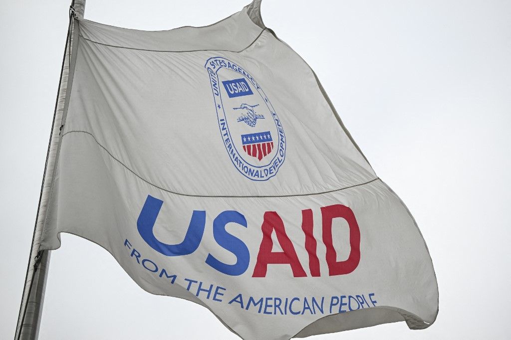 WASHINGTON DC, UNITED STATES - FEBRUARY 03: The USAID waves against a cloudy sky at U.S. Agency for International Development (USAID) headquarters in Washington D.C., United States on February 03, 2025. Staff across the US Agency for International Development (USAID) were abruptly informed Monday to stay out of their headquarters as tech billionaire Elon Musk said President Donald Trump has 'agreed' to shutter the agency. An email went out to all employees just after midnight informing them that 'at the direction of Agency leadership' their downtown Washington, DC headquarters 'will be closed to Agency personnel on Monday, February 3, 2025.' Celal Gunes / Anadolu (Photo by Celal Gunes / Anadolu via AFP)