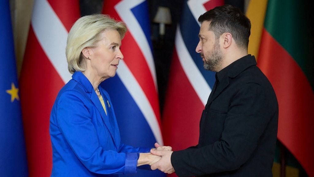 In this handout photograph taken and released by the Ukrainian Presidential Press Service on February 24, 2026, Ukraine's President Volodymyr Zelensky (R) greets European Commission President Ursula von der Leyen (L) prior to a meeting of Coalition of the Willing in Kyiv, as Ukraine marks the fourth anniversary of Russia's invasion. (Photo by Handout / UKRAINIAN PRESIDENTIAL PRESS SERVICE / AFP) / RESTRICTED TO EDITORIAL USE - MANDATORY CREDIT "AFP PHOTO / UKRAINIAN PRESIDENTIAL PRESS SERVICE" - NO MARKETING NO ADVERTISING CAMPAIGNS - DISTRIBUTED AS A SERVICE TO CLIENTS