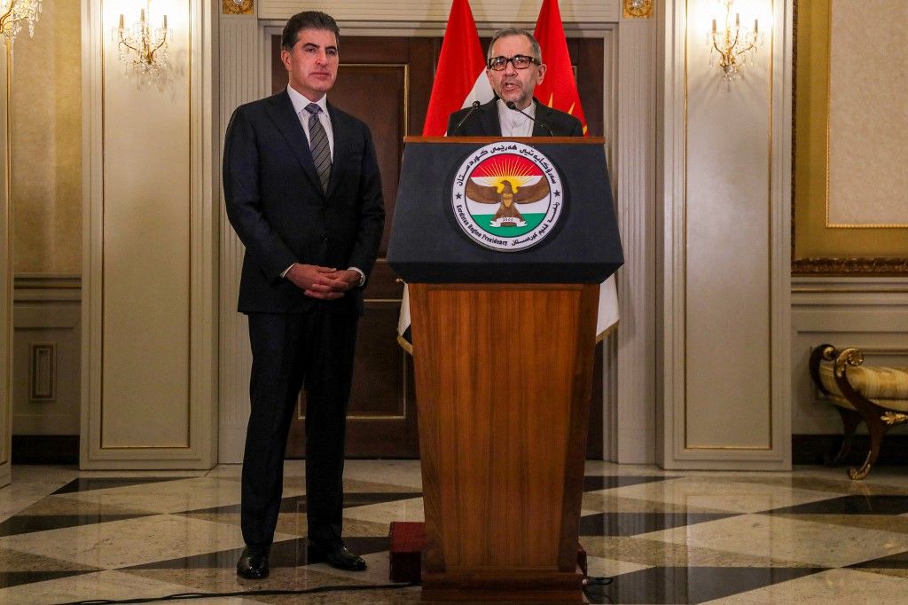 Nechirvan Barzani (L), President of Iraq's autonomous Kurdistan Region, and Majid Takht-Ravanchi (R), Iran's Deputy Foreign Minister for Political Affairs, give a joint press conference in the regional capital Arbil on February 17, 2025. (Photo by Safin HAMID / AFP)