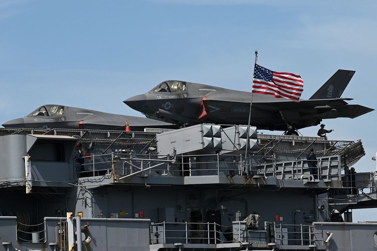 A pair of US Marine Corps F-35B Lightning II aircraft are seen on board the US Navys USS Tripoli (LHA-7) amphibious assault ship during a port call at the Port Area in Manila on September 27, 2022. (Photo by Jam STA ROSA / AFP)