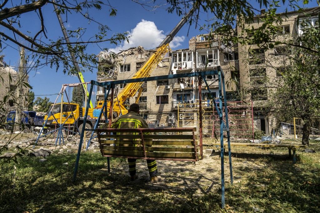 POKROVSK, UKRAINE - AUGUST 8: Firefighters and search and rescue teams conduct operation after Russian missile hit an apartment in Pokrovske, Donetsk Oblast, Ukraine on August 9, 2023. At least seven people were killed and 81 injured in an overnight missile strike by Russian forces on a city in Ukraine's eastern region of Donetsk, the Ukrainian Interior Ministry said on Tuesday. Jose Colon / Anadolu Agency (Photo by JOSE COLON / ANADOLU AGENCY / Anadolu via AFP)