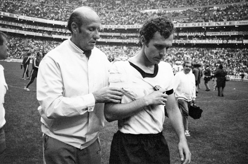 Helmut SCHOEN accompanies Franz BECKENBAUER, Germany, off the pitch after the match. (Photo by SVEN SIMON / dpa Picture-Alliance via AFP)