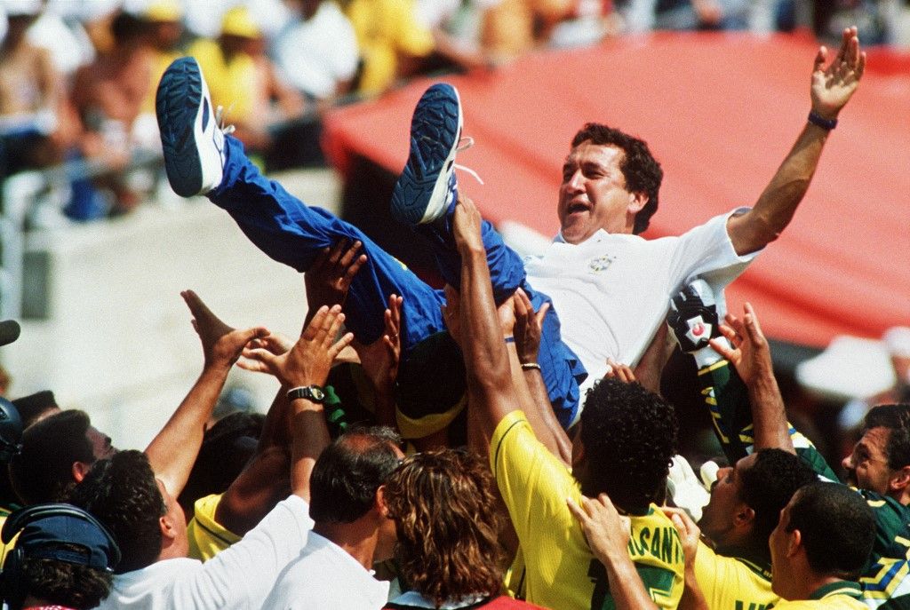Brazilian coach Carlos Parreira is thrown up in the air by his players after Brazil defeated Italy 3-2 in the shoot-out session (0-0 after extra time) at the end of the World Cup final 17 July 1994 at he Rose Bowl in Pasadena. AFP PHOTO/GABRIEL BOUYS (Photo by GABRIEL BOUYS / AFP)