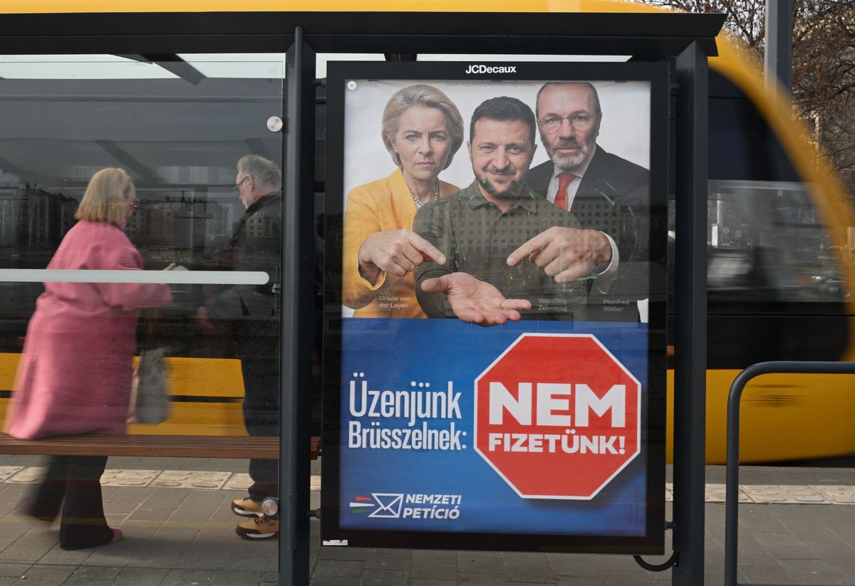 BUDAPEST, HUNGARY  MARCH 4: 
A government 'National Petition' campaign billboard depicting European Commission President Ursula von der Leyen, Ukrainian President Volodymyr Zelenskyy, and EPP leader Manfred Weber is displayed at a tram stop in Budapest on March 4, 2026. (Photo by Artur Widak/NurPhoto) (Photo by Artur Widak / NurPhoto via AFP)