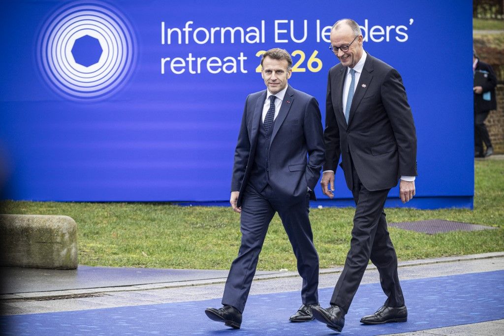 President of France Emmanuel Macron and Federal Chancellor of Germany Friedrich Merz arrive and talk to the media and international press ahead of the Informal EU leaders' retreat 2026 summit, at Alden Biesen Castle hosted by the European Council President. The European leaders meeting was about how to deepen the single market, reduce economic dependencies, strengthen EU competitiveness and strategic autonomy, planning the future initiative roadmap 'one Europe, one market' and boost competitiveness through common actions. Rijkoven, Bilzen-Hoeselt, Belgium on February 12, 2026 (Photo by Nicolas Economou/NurPhoto) (Photo by Nicolas Economou / NurPhoto via AFP)