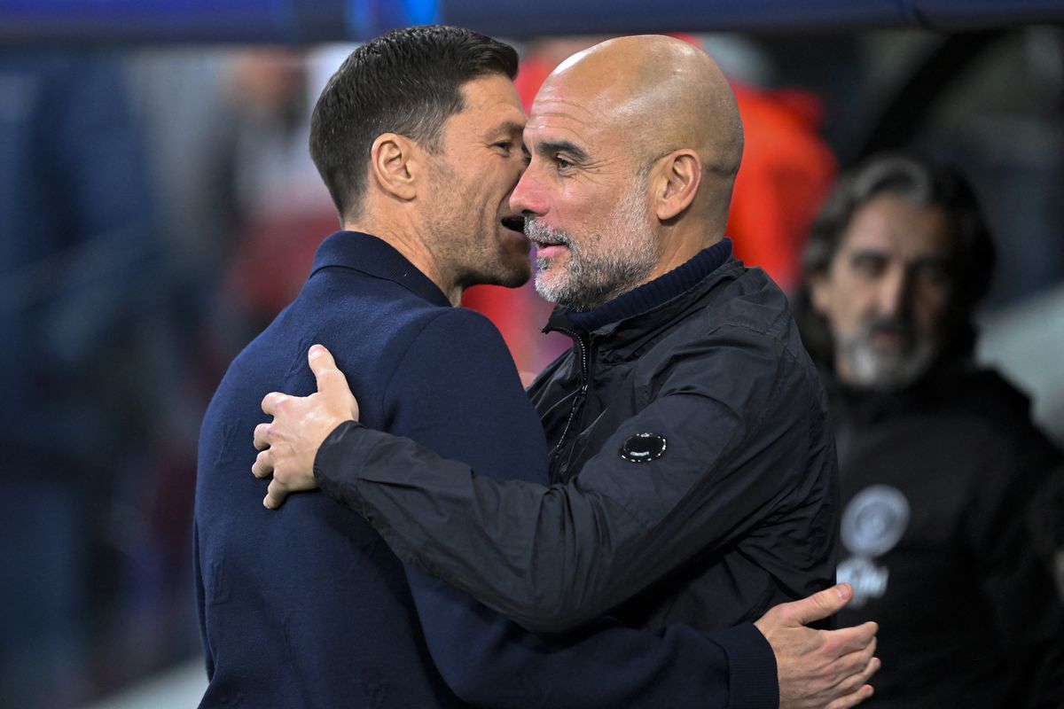 MADRID, SPAIN - DECEMBER 10: Head coach Xabi Alonso of Real Madrid and Head Coach Pep Guardiola of Manchester City greet each other before the UEFA Champions League week 6 football match between Real Madrid and Manchester City at Bernabeu Stadium in Madrid, Spain on December 10, 2025. Burak Akbulut / Anadolu (Photo by BURAK AKBULUT / Anadolu via AFP)