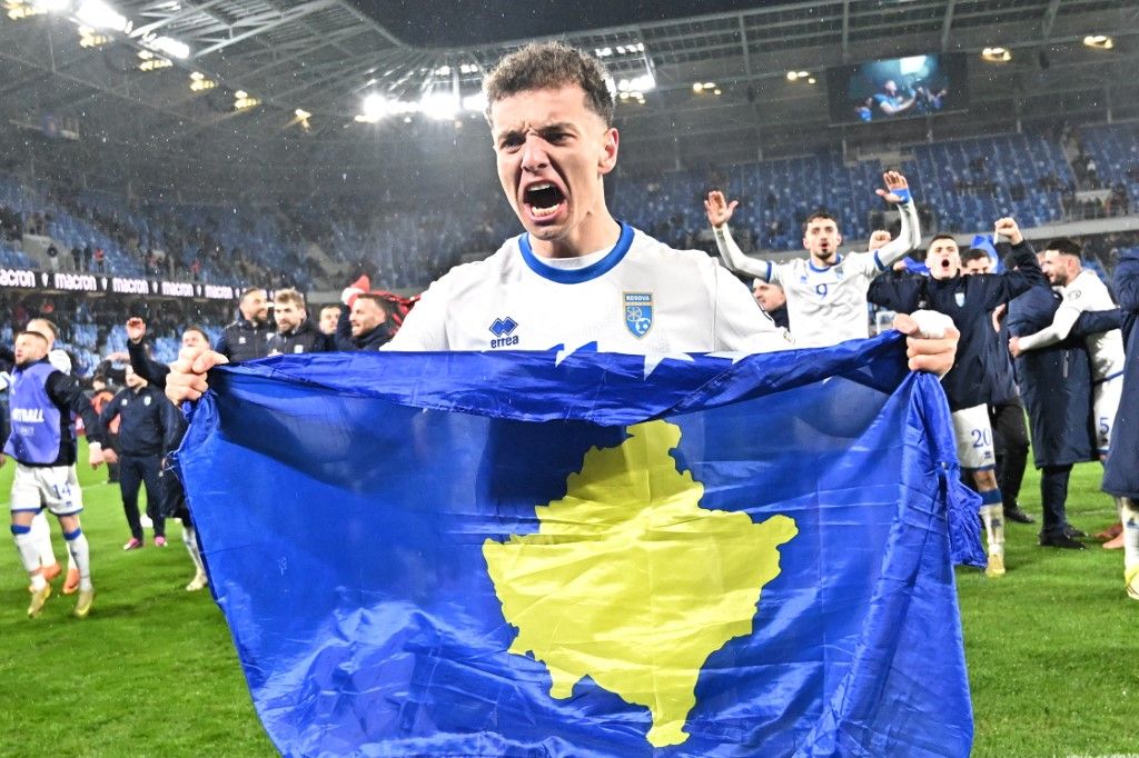 Kosovo's forward #11 Fisnik Asllani celebrates after the play-off 2026 FIFA World Cup European qualification semi-final football match between Slovakia and Kosovo in Bratislava on March 26, 2026. (Photo by Joe Klamar / AFP)