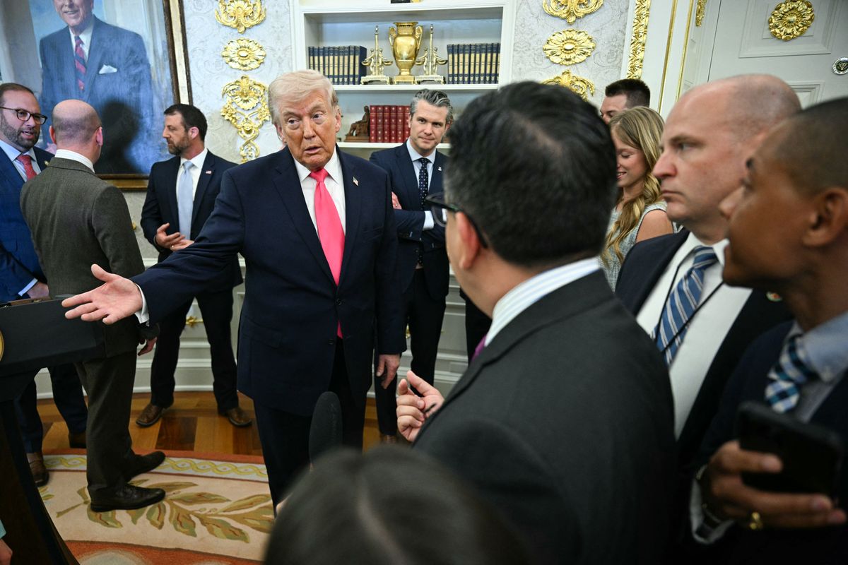 US President Donald Trump speaks with reporters at the conclusion of a swearing in ceremony for the new Secretary of Homeland Security Markwayne Mullin in the Oval Office of the White House in Washington, DC, on March 24, 2026. The US Senate on Monday confirmed Mullin as the new chief of the Department of Homeland Security (DHS), the agency reeling from a partial government shutdown as it works to enforce President Donald Trump's immigration crackdown. (Photo by Jim WATSON / AFP)