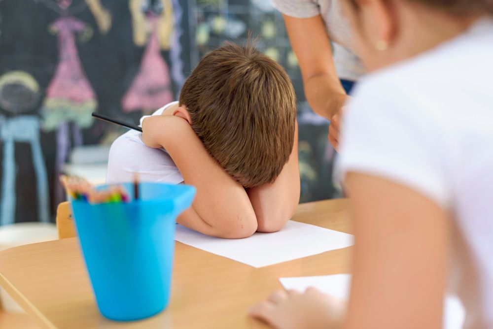 Cute boy is not happy at kindergarten. Harness and support for children at early age. The Emotional Abuse of Children at School