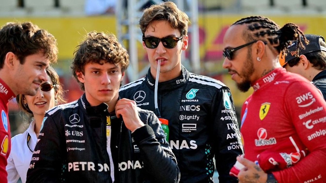 (From L-R) Ferrari's Monaco driver Charles Leclerc, Mercedes' Italian driver Kimi Antonelli, Mercedes' British driver George Russell, and Ferrari's British driver Lewis Hamilton stand on the grid ahead of the Abu Dhabi Formula One Grand Prix at the Yas Ma