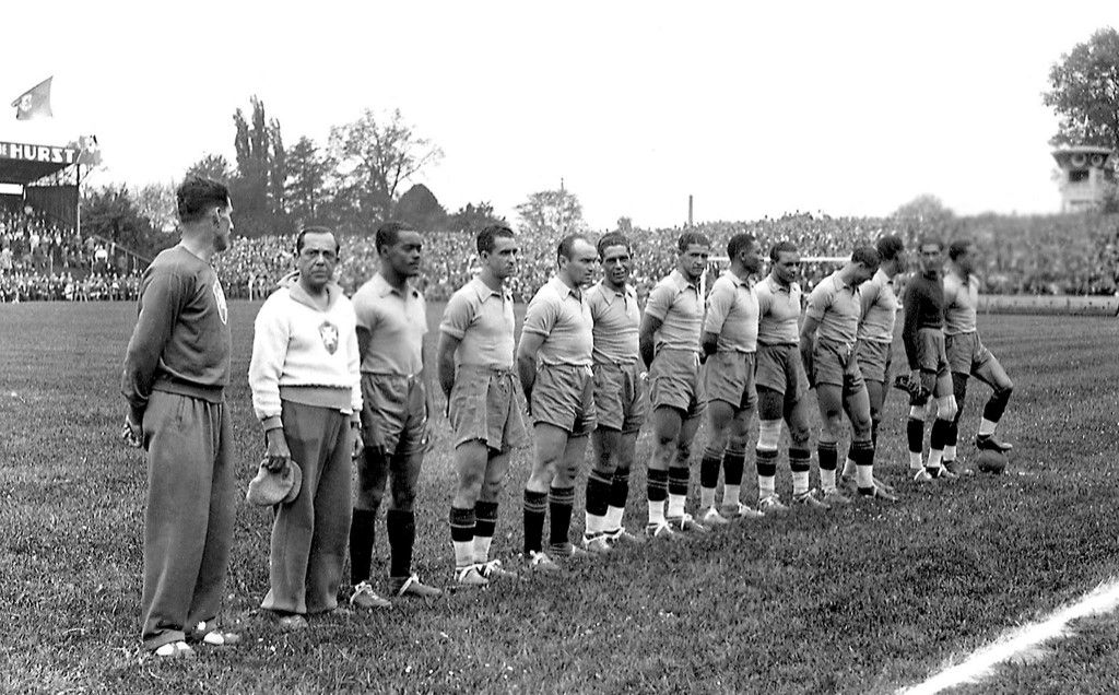 Brazilian national soccer team players are lined up before the start of their World Cup preliminary round soccer match against Poland 05 June 1938 in Strasbourg. Brazil defeated Poland 6-5 in extra time (4-4 at the end of regulation time) as forward Leonidas (3rd L), with coach Ademir Pimenta to his right, scored three goals. Polish forward Ernest Willimowski scored four goals for his team. AFP PHOTO (Photo by AFP)