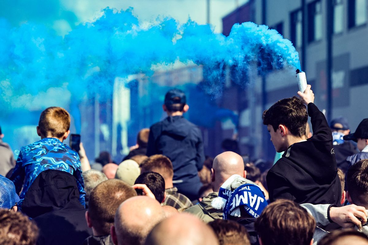 Everton fans arrive at Hill Dickinson with flares for derby day during the Premier League match between Everton and Liverpool at Hill Dickinson Stadium in Liverpool, United Kingdom, on April 19, 2026. (Photo by Alfie Cosgrove/News Images/NurPhoto) (Photo by News Images / NurPhoto via AFP)
