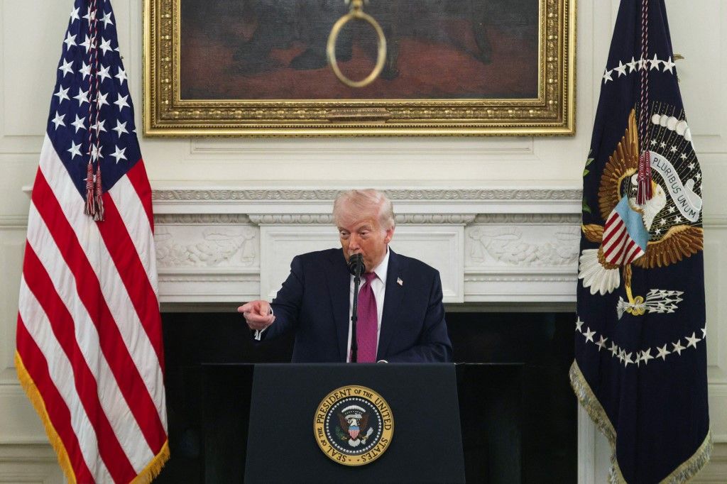 WASHINGTON, DC - APRIL 21: U.S. President Donald Trump makes remarks as he hosts NCAA champion athletes during a NCAA&nbsp;Collegiate National Champions Day event in the State Dining Room at the White House on April 21, 2026 in Washington, DC. The White House hosted more than 100 champion collegiate student athletes during their annual NCAA Collegiate National Champions Day.   Alex Wong/Getty Images/AFP (Photo by ALEX WONG / GETTY IMAGES NORTH AMERICA / Getty Images via AFP)