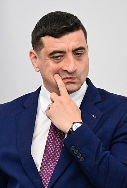 Presidential candidate and leader of AUR party George Simion is pictured during an electoral meeting with Romanian and foreign business representantives at Romanian Commerce and Industry Chamber CCIR in Bucharest, Romania, on May 13, 2025. After comfortably topping the first round of the presidential election rerun earlier this month, Simion will face centrist Bucharest mayor Nicusor Dan in the second round. (Photo by Daniel MIHAILESCU / AFP)